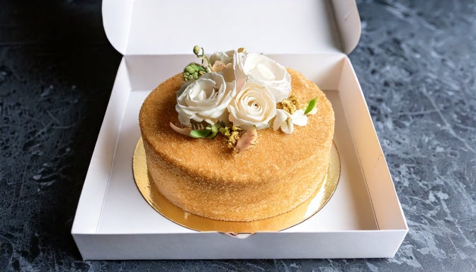 Custom celebration cake in an open delivery box for same-day cake delivery in Santa Monica and Brentwood
