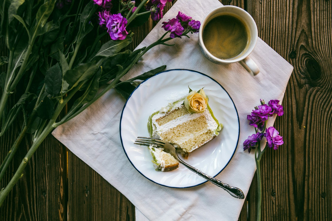 A single slice of cake on a white plate with a fork, the format most people picture when searching cake by the slice near me