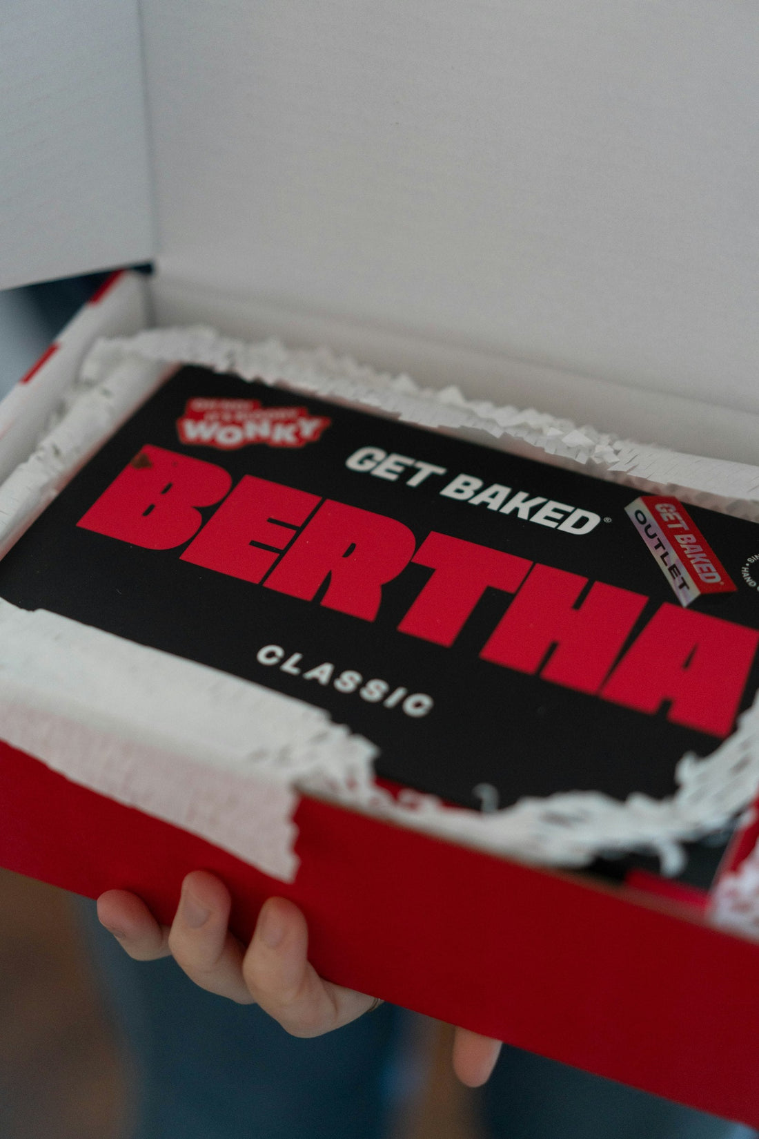 A boxed cake being presented at a handoff, the kind of short local delivery Sweet Angeles runs from Beverly Hills into Century City and Westwood