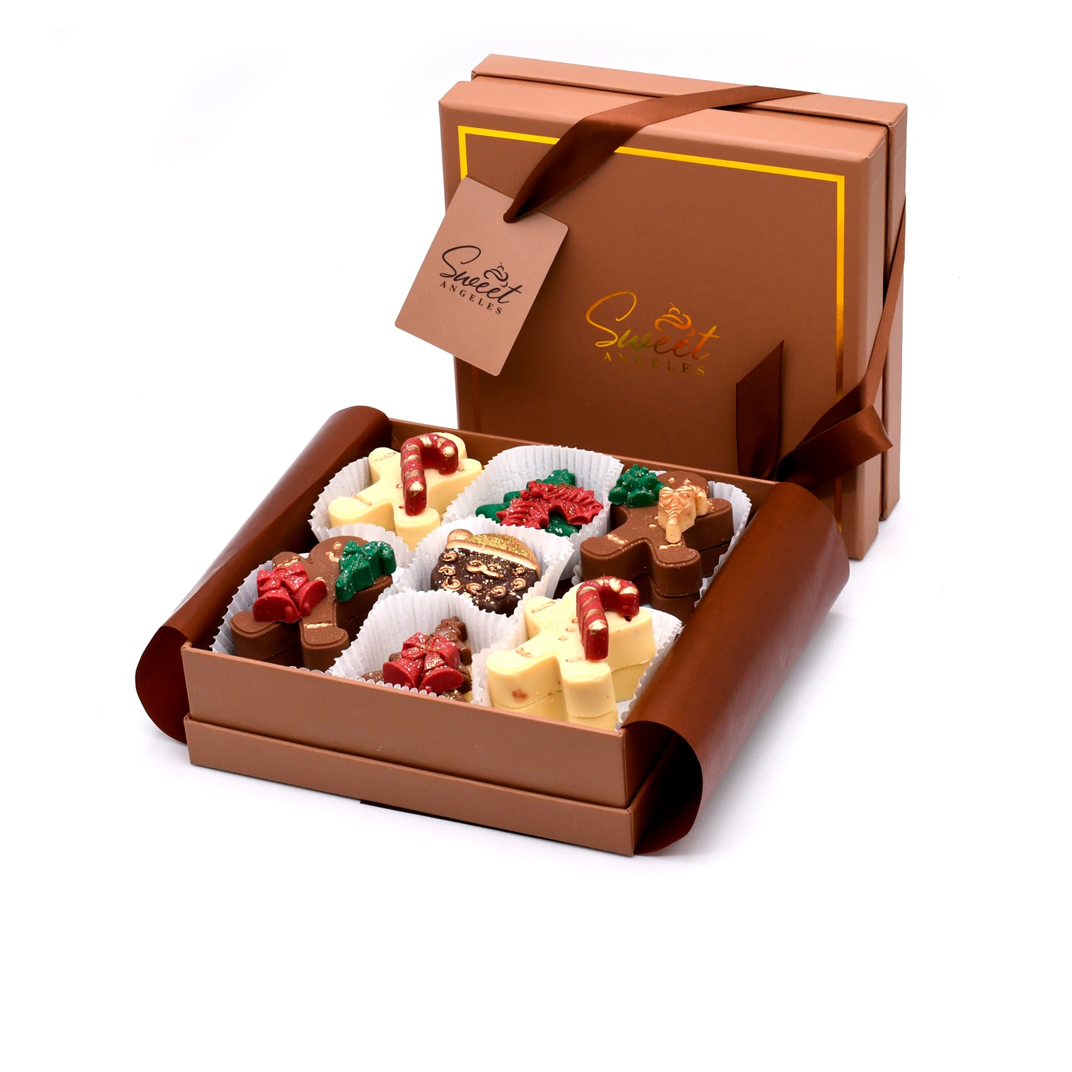 A brown gift box with a ribbon, partially open to reveal assorted festive chocolates decorated with holiday-themed designs, such as candy canes, gifts, and holly leaves.