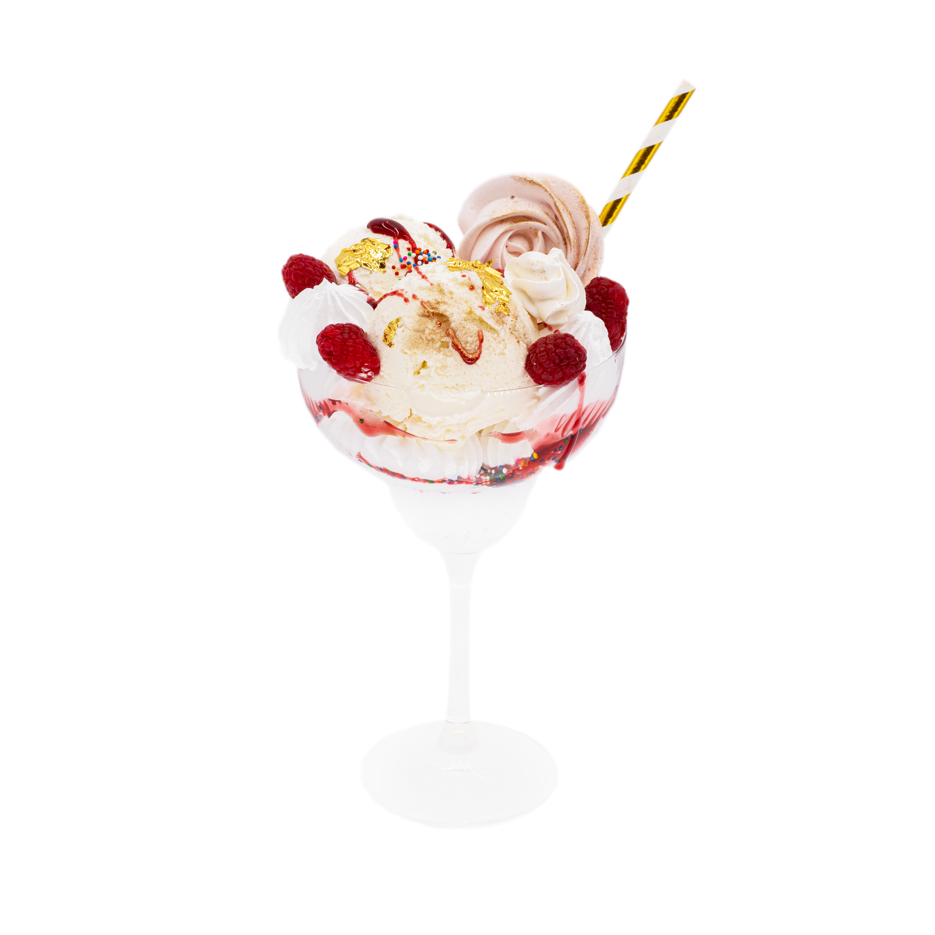 Decadent dessert cup with vanilla ice cream, fresh raspberries, whipped cream, and gold leaf