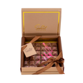 Luxury artisan chocolate bar with pink decoration in elegant gift box with ribbon
