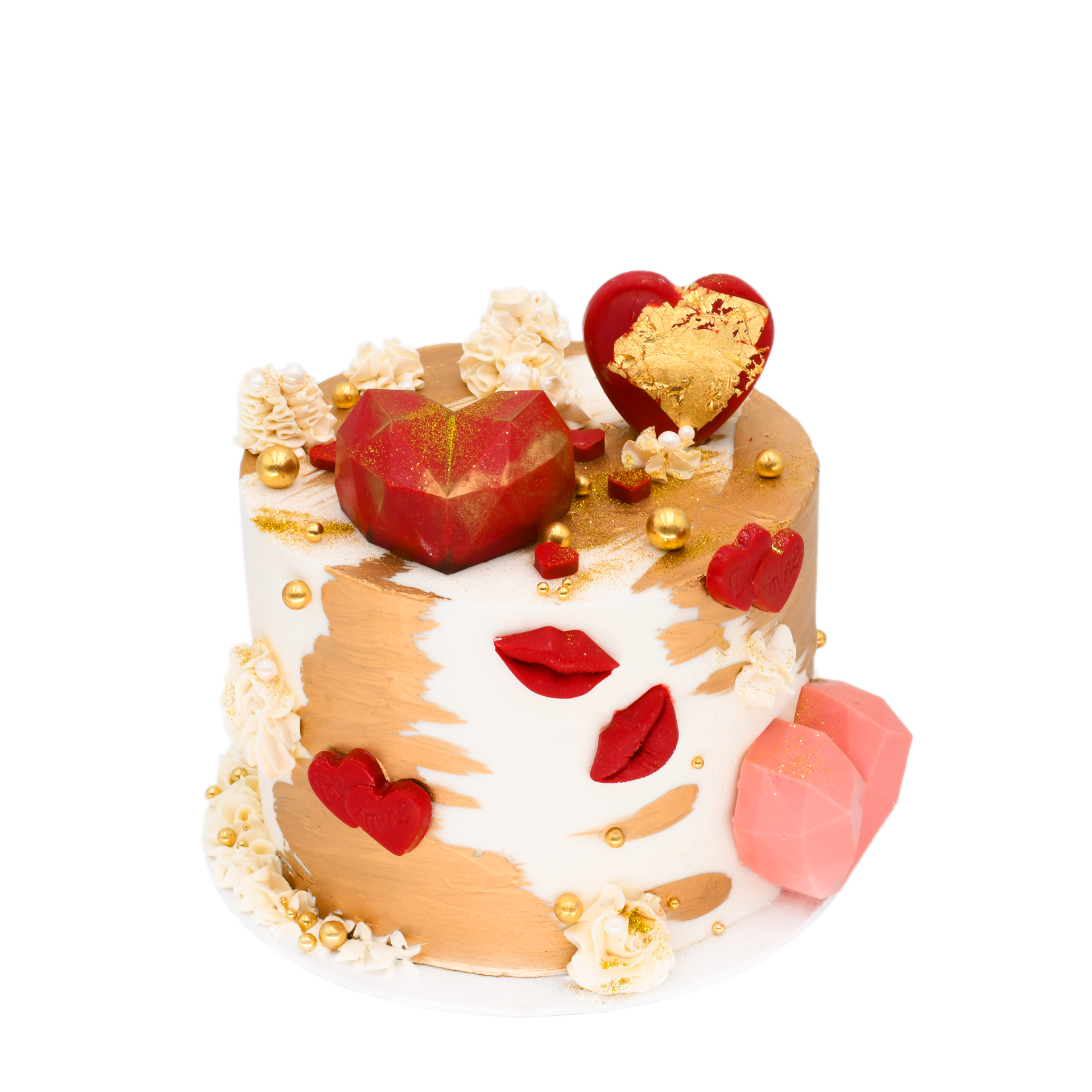 Handcrafted custom cake decorated with gold accents, red lips, and heart-shaped chocolates