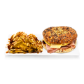Everything bagel sandwich with ham, cheese, eggs and chips on a white rectangular plate