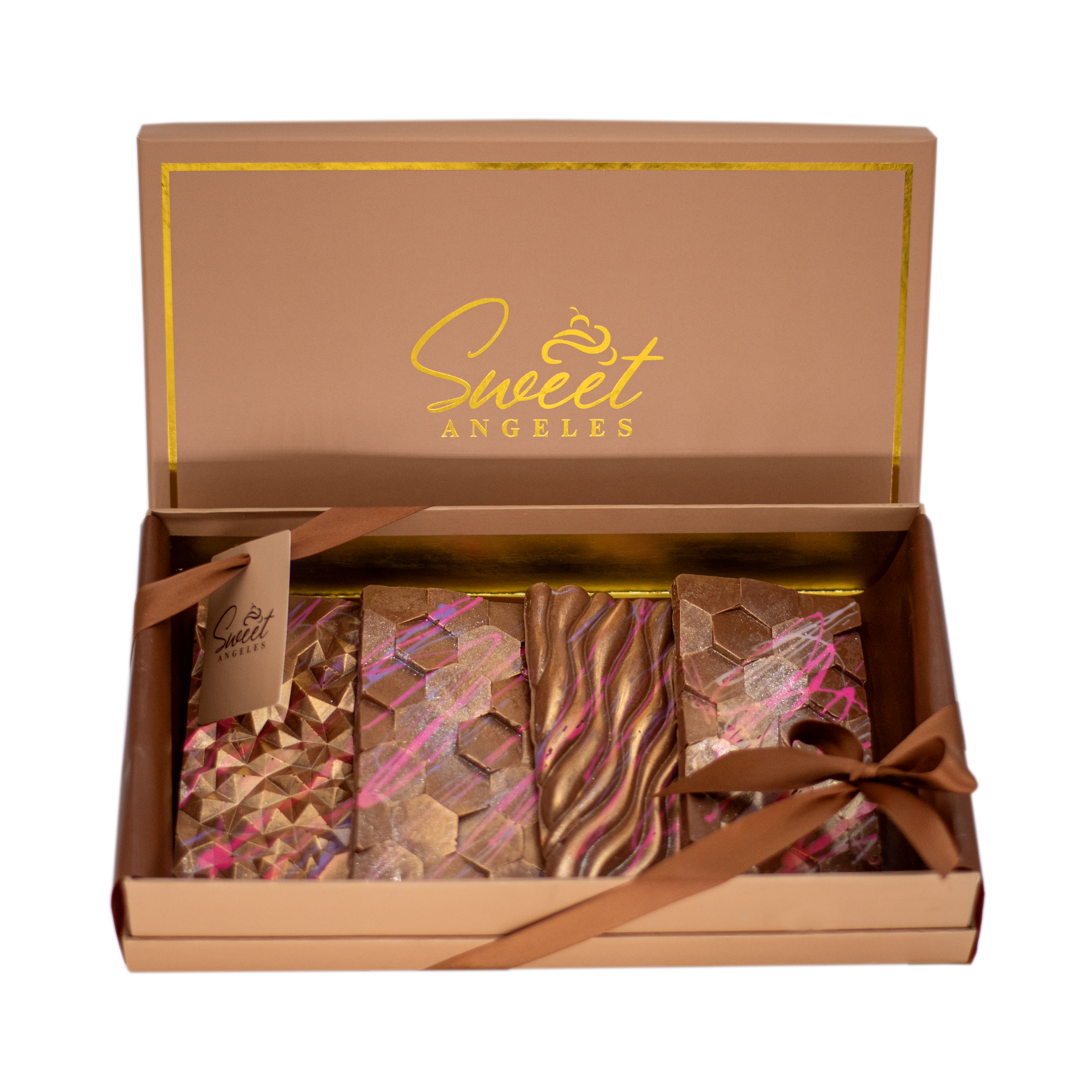 Luxury assorted chocolate bars with gold and pink designs in a gift box with ribbon
