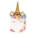 Unicorn cake with gold horn, pastel buttercream flowers, and fondant ears, ideal for celebrations