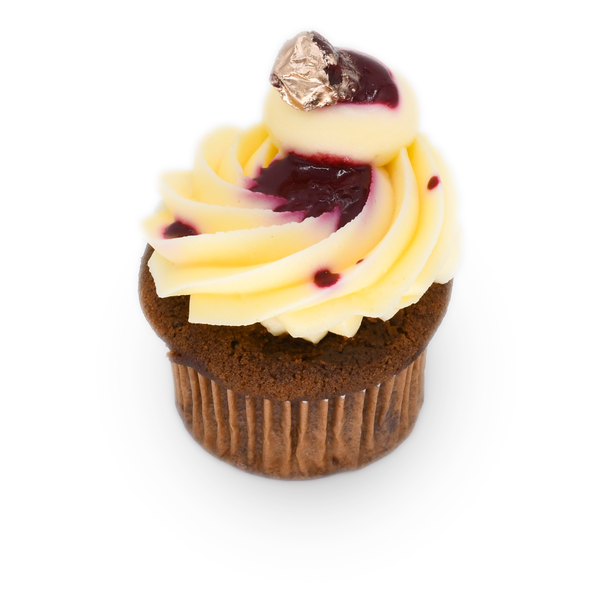 Chocolate cupcake with swirled vanilla frosting, berry topping, and gold foil accent