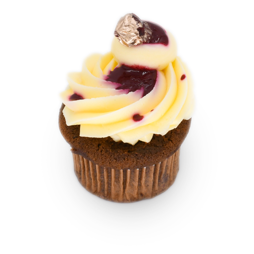 Chocolate cupcake with swirled vanilla frosting, berry topping, and gold foil accent