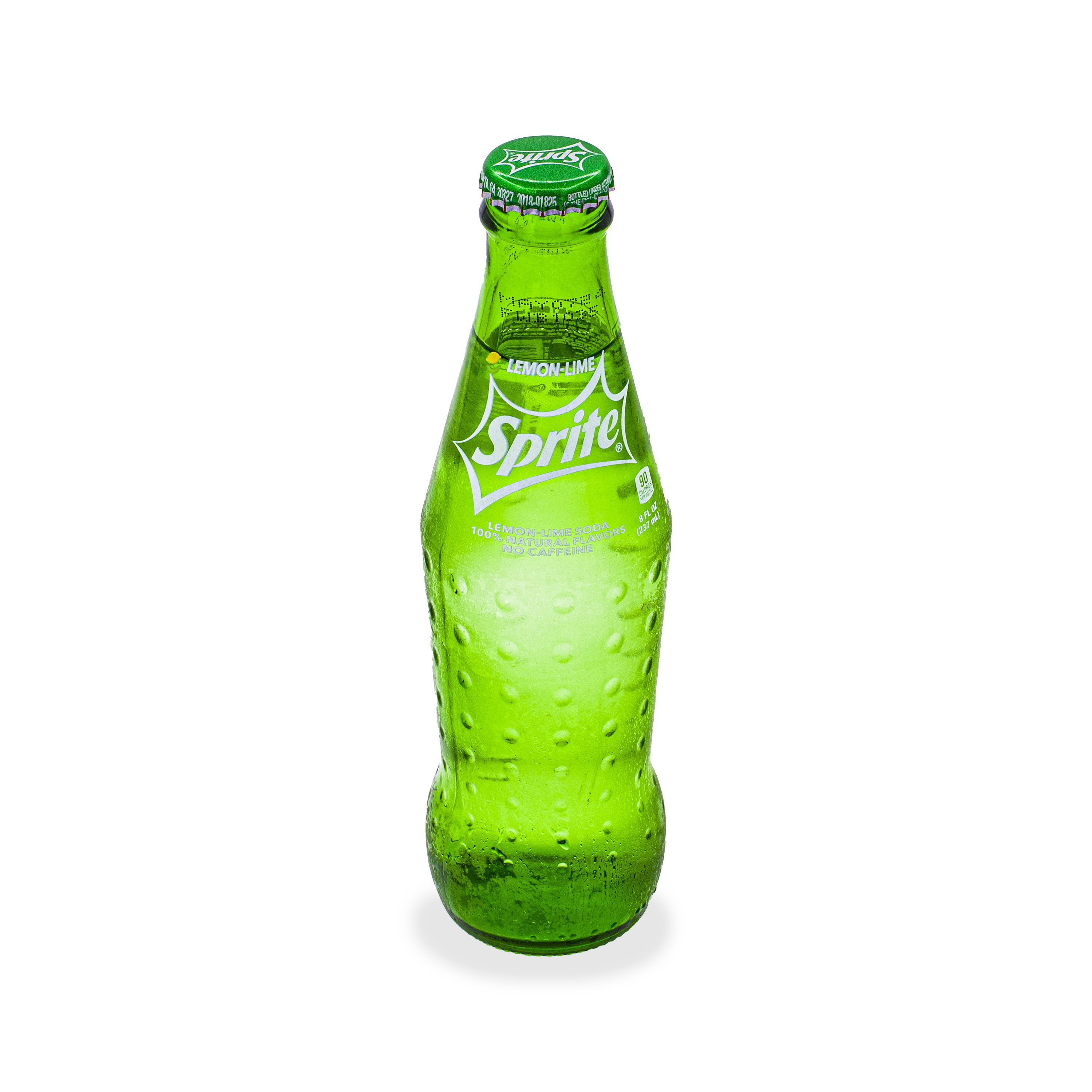 Chilled glass bottle of lemon-lime soda with condensation on white background