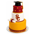 USC Graduation Cake – 3 Tier featuring a yellow, white, and red layered design with a black graduation cap topper, diploma decoration, and custom details celebrating achievement.