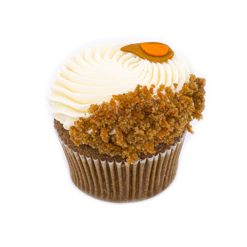 Carrot cupcake with cream cheese frosting and carrot crumble topping on a white background.