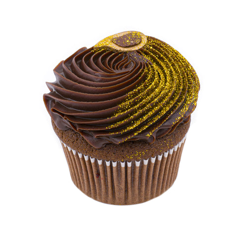 Chocolate cupcake with swirled ganache frosting and gold glitter decoration