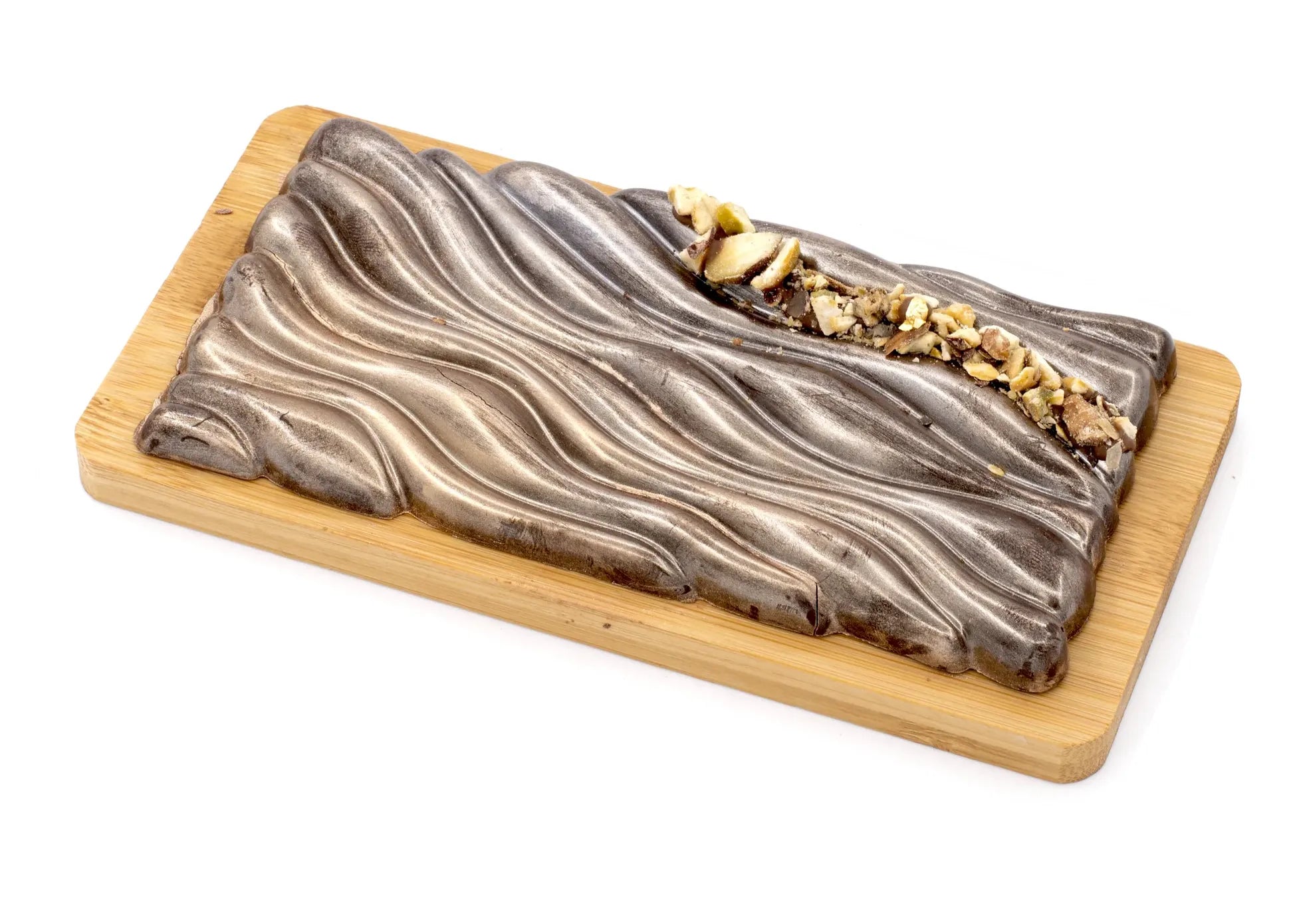 Gourmet dark chocolate bar with pistachio filling on a wooden board