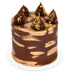 Elegant Double Chocolate Cake with rich chocolate frosting, gold accents, and decorative swirls, showcasing luxury custom cakes baked fresh in Beverly Hills.