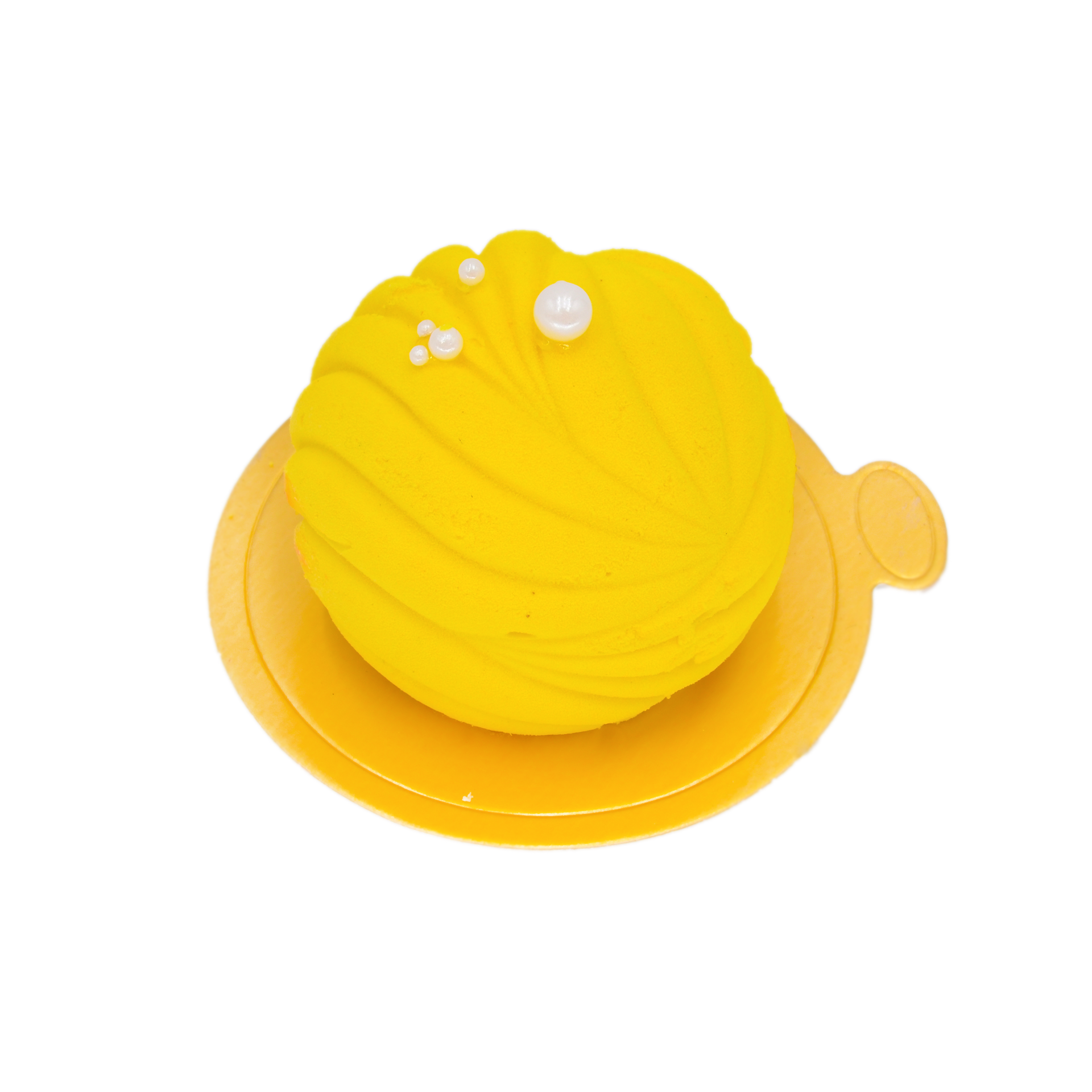Round yellow lemon mousse dessert with swirl pattern and pearl decorations on gold base