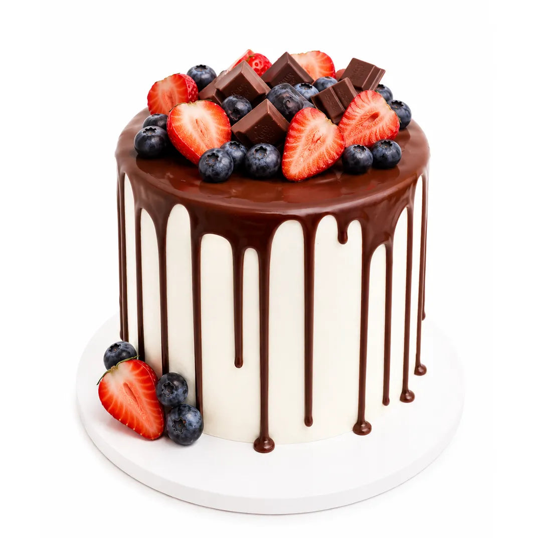 Marble fruit mousse cake with white buttercream, chocolate drip glaze, Kinder pieces, fresh strawberries and blueberries — cake delivery at Sweet Angeles Los Angeles