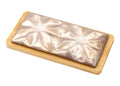 Milk chocolate bar with white chocolate ganache, glossy finish, on wooden board