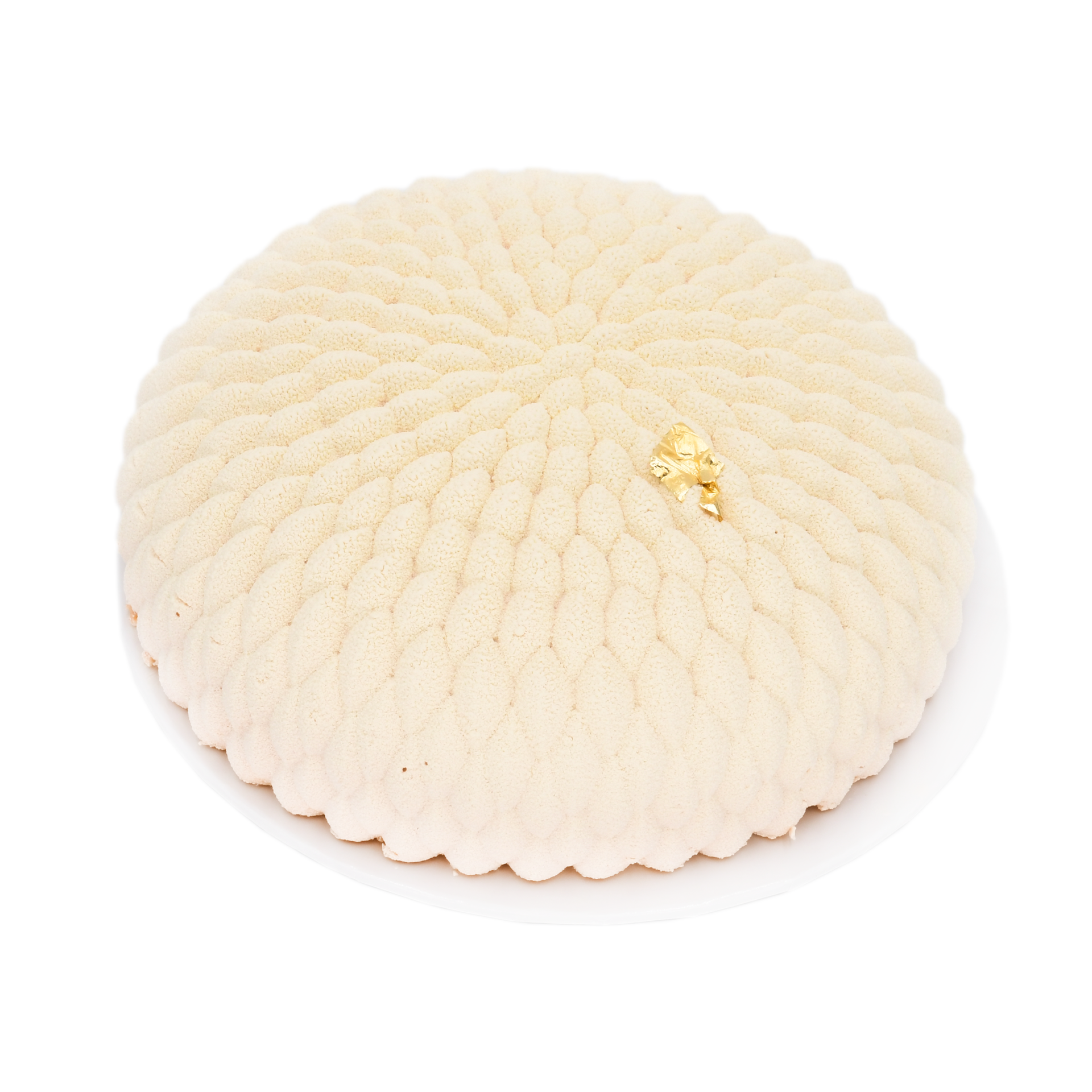 Elegant white mousse cake with textured pattern and gold leaf decoration on white plate