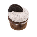 Chocolate cupcake with cookies and cream frosting topped with a chocolate cookie on white background