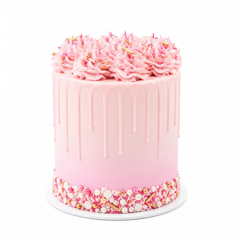Pink Sparkle Cake with smooth pink ombre icing, delicate drip decoration, topped with swirls of pink frosting and edible gold and white pearls, creating a luxurious custom birthday cake.