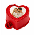 Red Love Story Rose Heart Cake with a custom photo on top, decorated with red edible pearls and a red rose on the side, perfect for romantic celebrations.