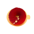 Red velvet mousse dessert with gold leaf decoration on a golden tray