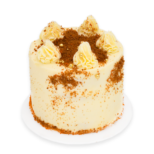 Vanilla frosted custom cake with golden sprinkles and cookie crumb decoration on top