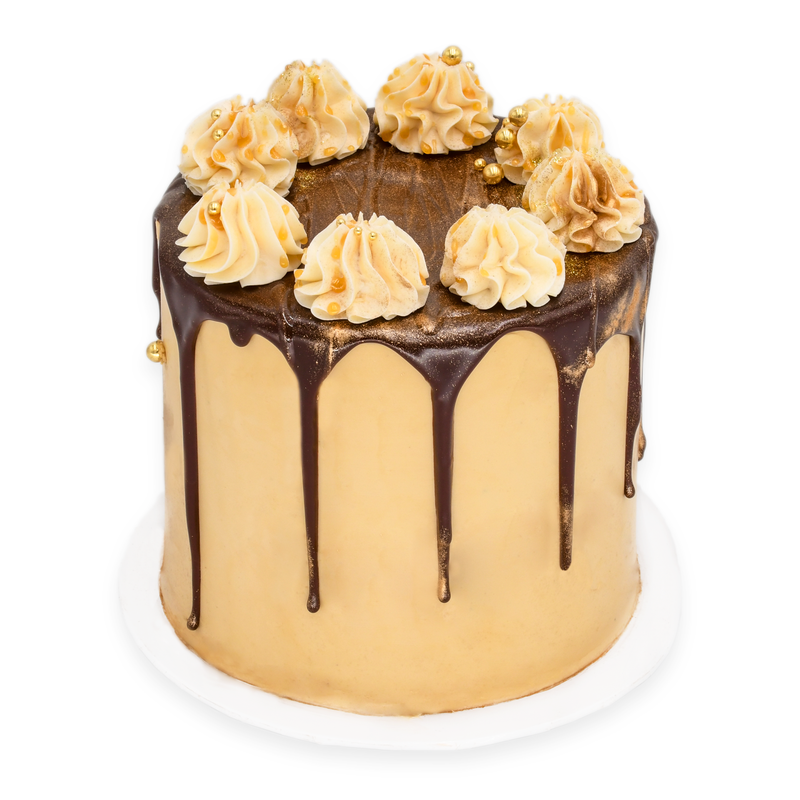 Gourmet custom cake with chocolate drip, gold accents, and piped buttercream decorations