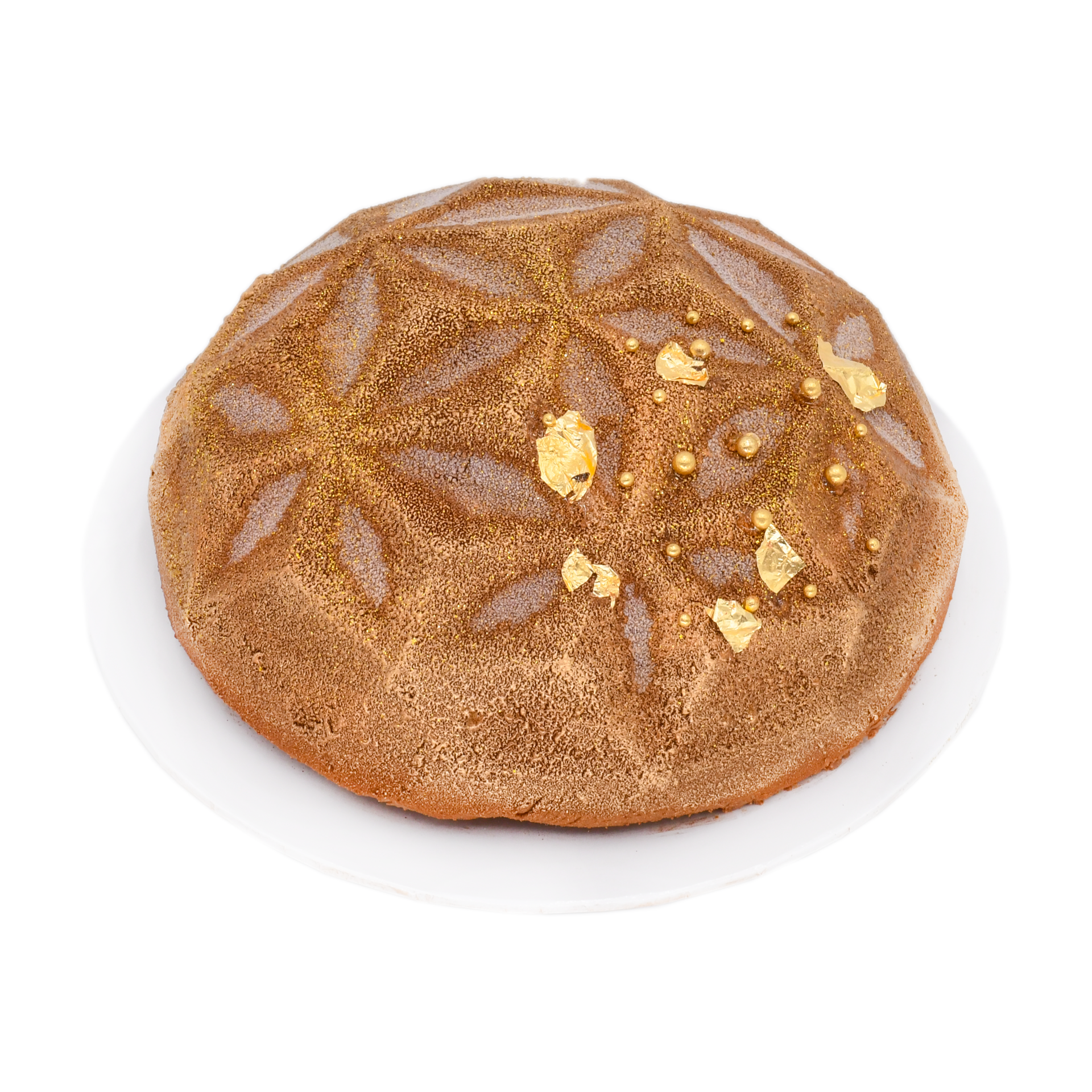 Elegant three chocolate mousse cake with gold leaf and geometric pattern on white plate