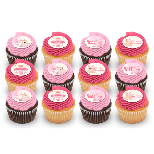 Assorted baby shower cupcakes with pink frosting and themed edible toppers