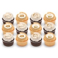 Assorted chocolate and vanilla anniversary cupcakes with gold decorations and white frosting