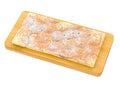 White chocolate bar with espresso and lemon, silver accents, on wooden board