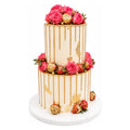 Two-tier Gold Drip Rose & Strawberry Cake decorated with pink roses, gold-dusted strawberries, and gold accents, showcasing an elegant luxury custom cake design.