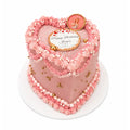 Birthday Queen Heart Cake featuring pink heart-shaped design with piped frosting, white and gold edible pearls, and a custom edible photo topper celebrating a birthday.