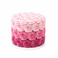 Pink Ombre Party Cake featuring three layers of intricately piped rosettes in varying shades of pink, creating a gradient effect perfect for celebrations.
