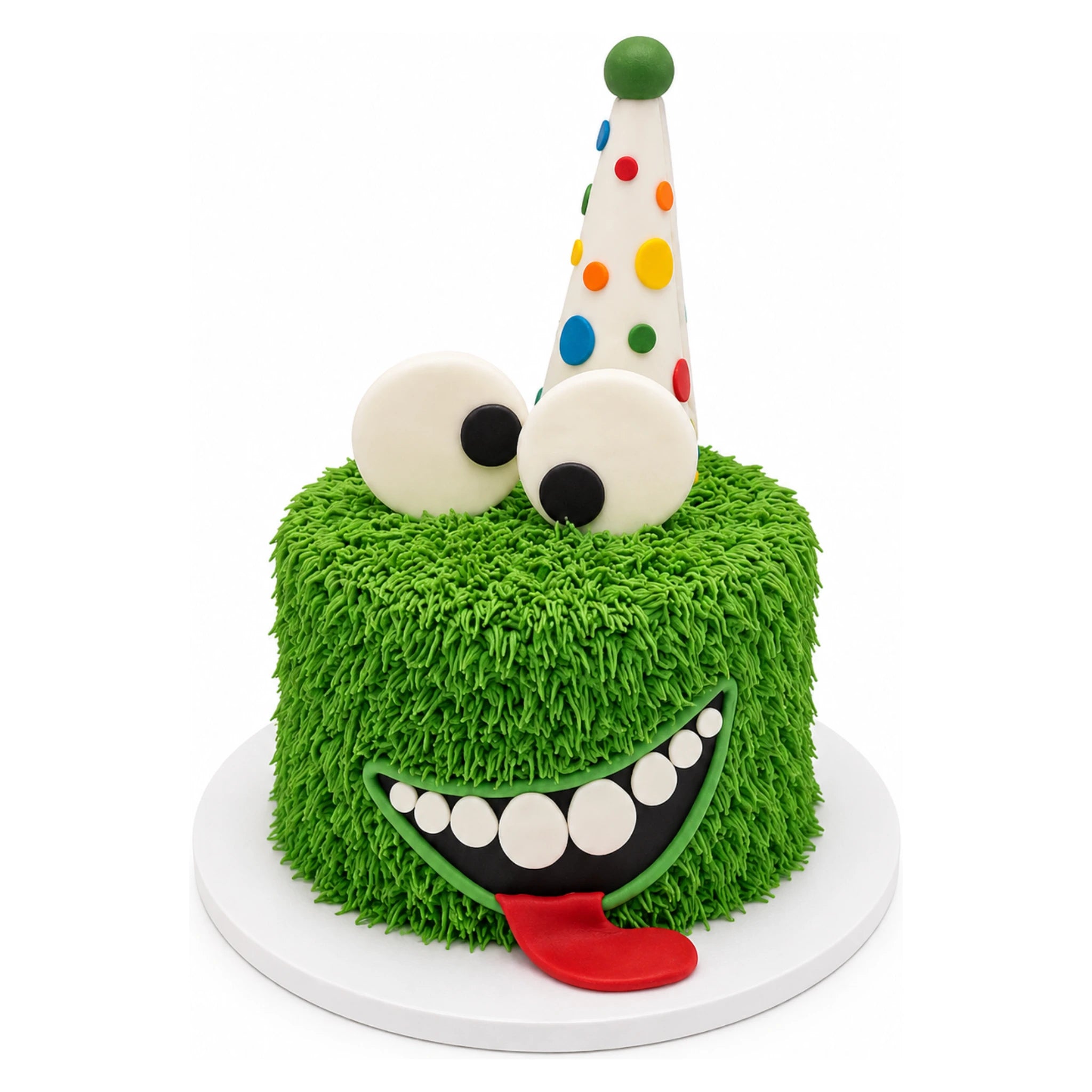Little Monster Birthday Cake with bright green textured frosting, large playful eyes, a wide smiling mouth with white teeth, red tongue, and a colorful polka dot party hat.