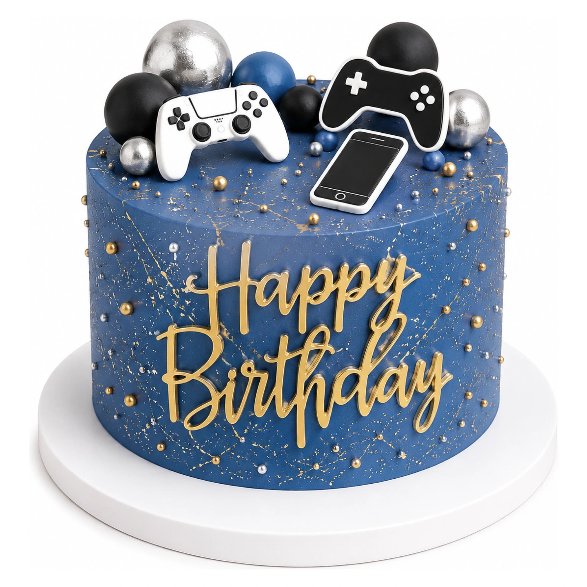 Blue birthday cake with gold speckled decoration topped with black, silver, and blue balls, and edible gaming-themed toppers including two controllers and a smartphone shape.