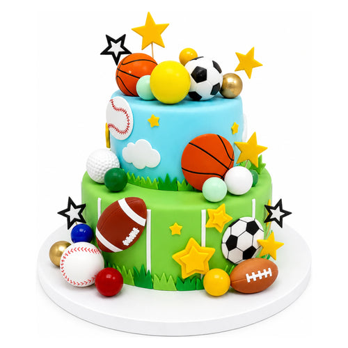 Two-tier cake decorated with fondant baseballs, footballs, basketballs, soccer balls, golf balls, stars, and clouds on green and blue frosting with grassy and sky details.