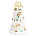 White Gold Seashell Tier Cake with elegant gold accents, light blue seashell decorations, and a "Happy Birthday" topper, perfect for a custom birthday celebration.