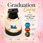 Custom School Logo Happy Graduation Cake featuring a black graduation cap topper and UCLA logo on an elegant white and black cake with gold accents, luxury custom cakes baked fresh in Beverly Hills.