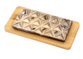 Gourmet pecan chocolate bar with geometric pattern on wooden board