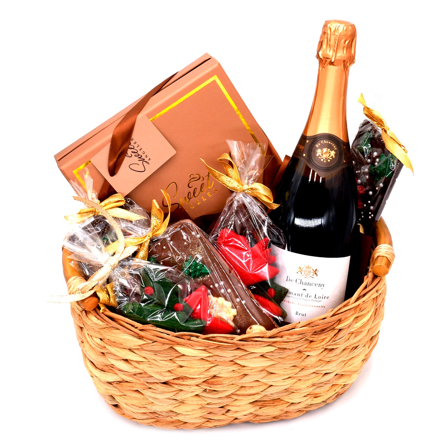 Gift basket with chocolate treats, a box of sweets, and a bottle of sparkling wine