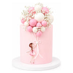Pink Balloon Girl Cake featuring a smooth pink fondant finish, decorated with pink and white balloon-shaped spheres and delicate white flowers, with a fondant girl holding balloon strings.