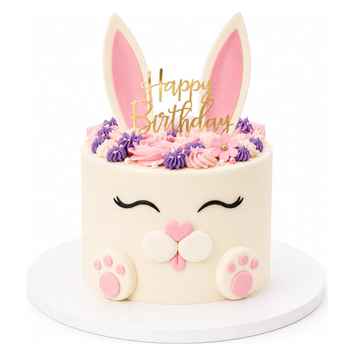 Cute Bunny Cake decorated with pink and purple frosting, bunny ears, paws, and a gold "Happy Birthday" topper, perfect for custom birthday celebrations.