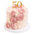 Pink Rose Garden Cake featuring elegant pink and white buttercream roses with pearl accents and a gold "50" topper, perfect for a sophisticated celebration.