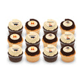 Happy Graduation assortment of chocolate and vanilla cupcakes topped with creamy frosting and edible decorations featuring graduation caps, diplomas, and congratulatory messages.