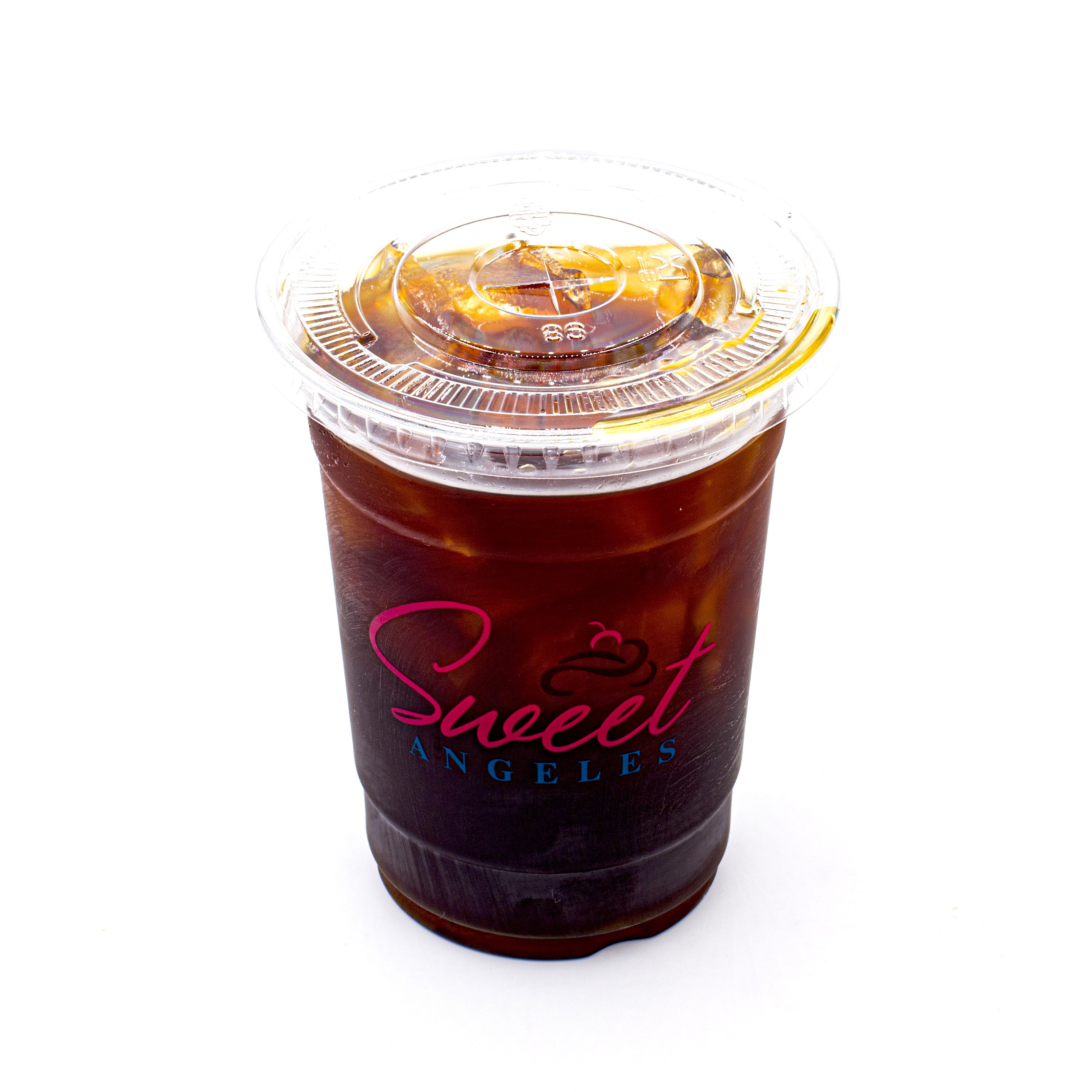 Iced tea in a clear plastic cup with lid and visible logo, filled with ice, on white background