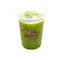 Iced matcha latte in a clear plastic cup with ice and logo on white background