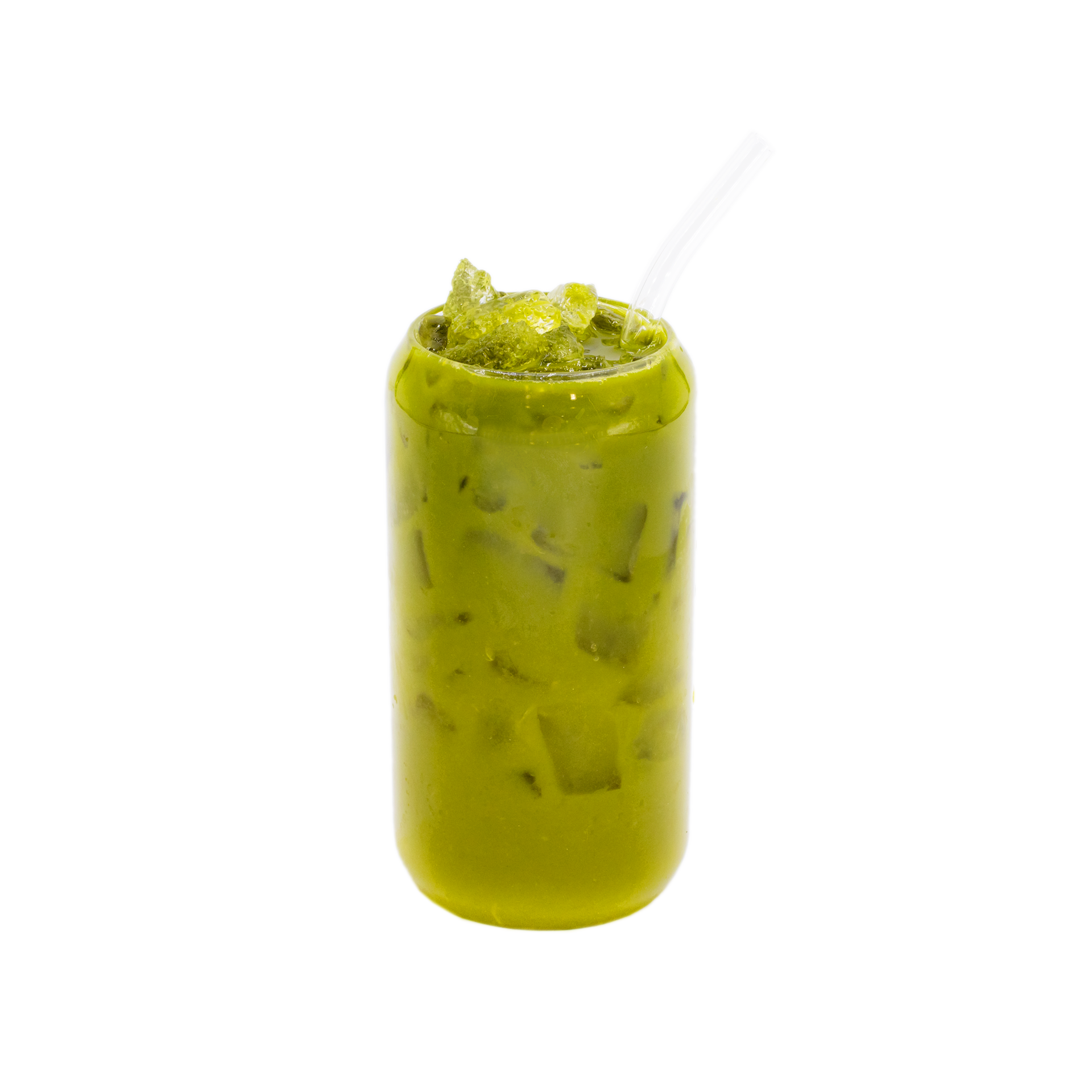 Iced matcha latte in a clear glass with ice and a straw on white background