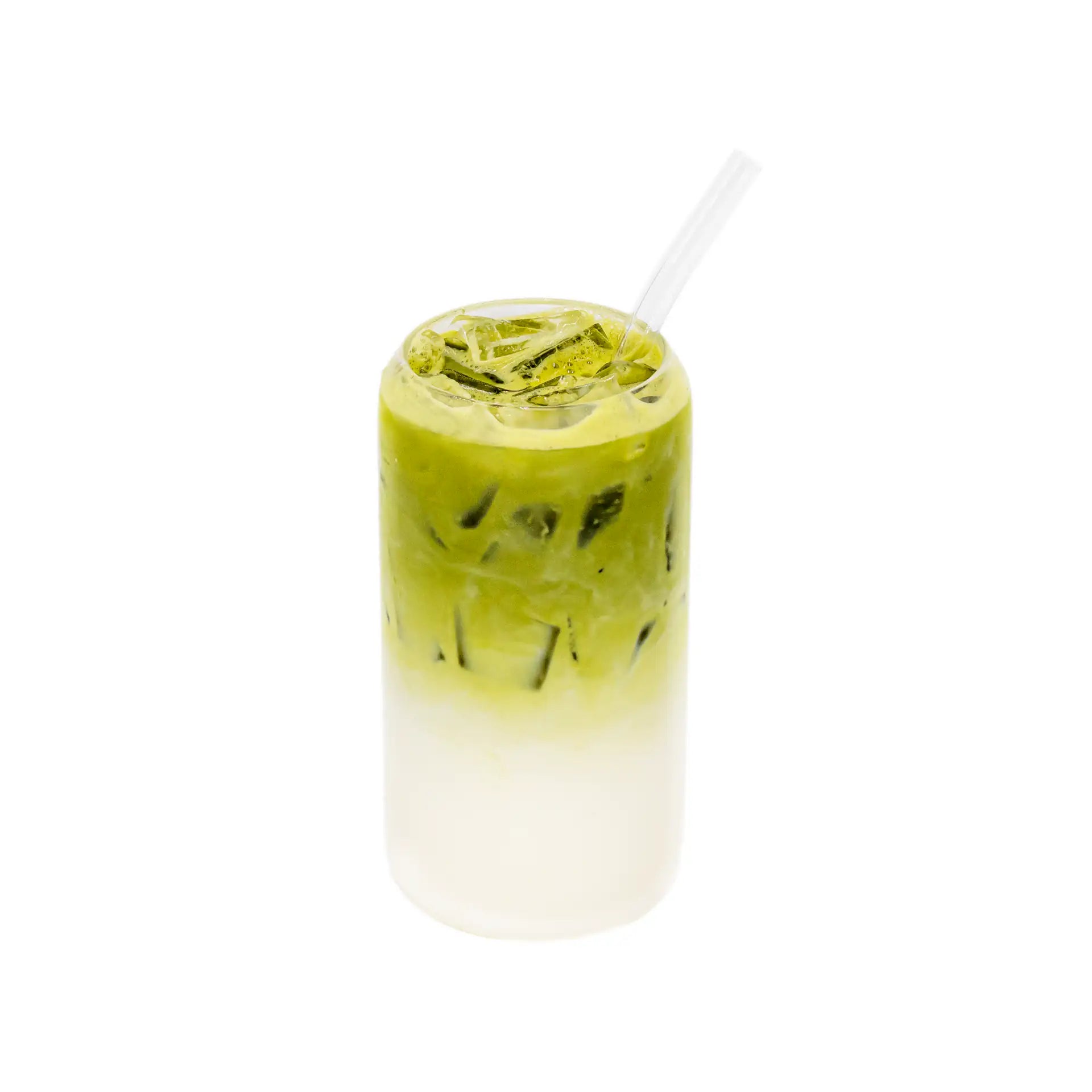 Iced matcha latte with milk in a clear glass, layered green and white, with straw